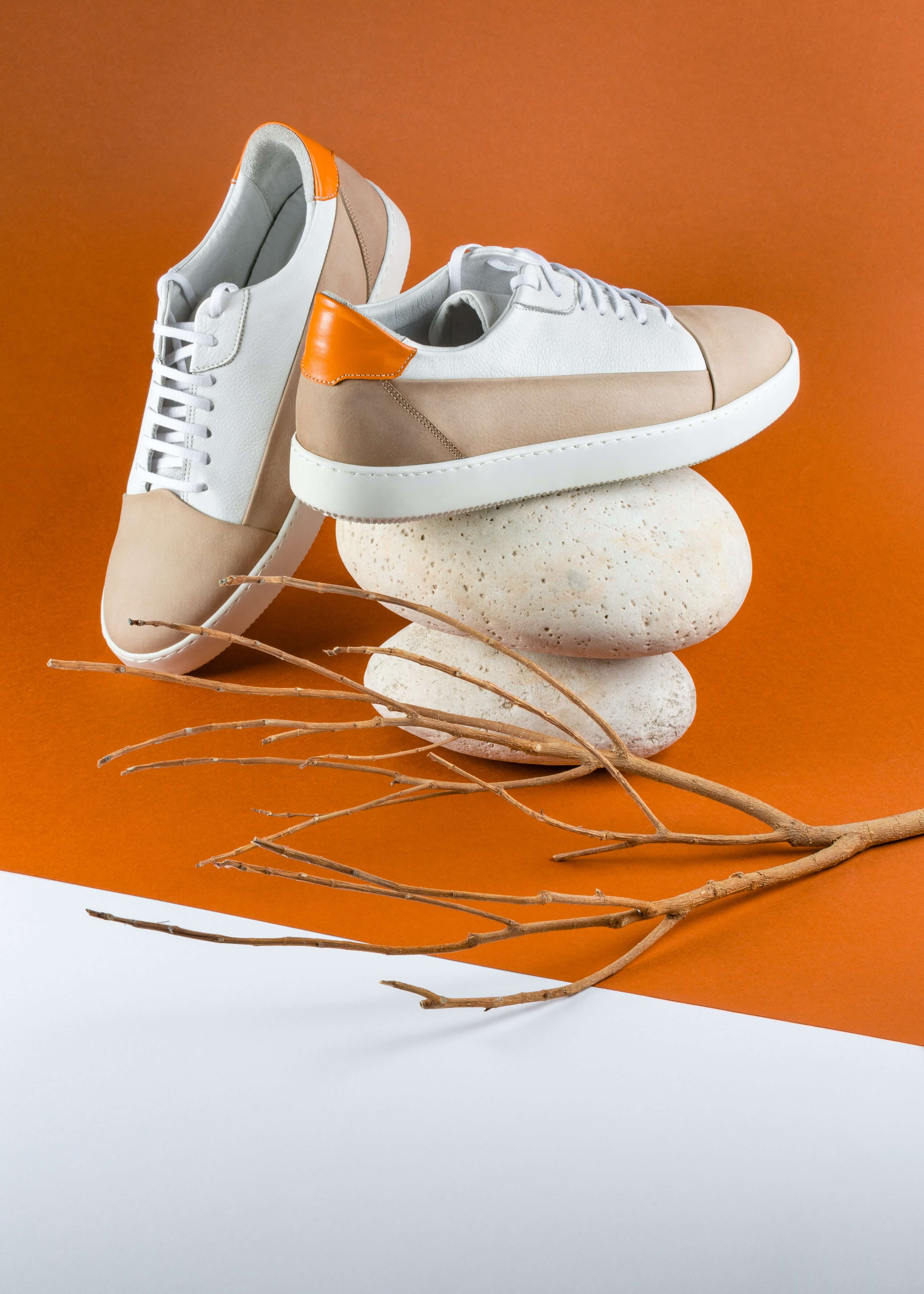 A pair of shoes over some stones